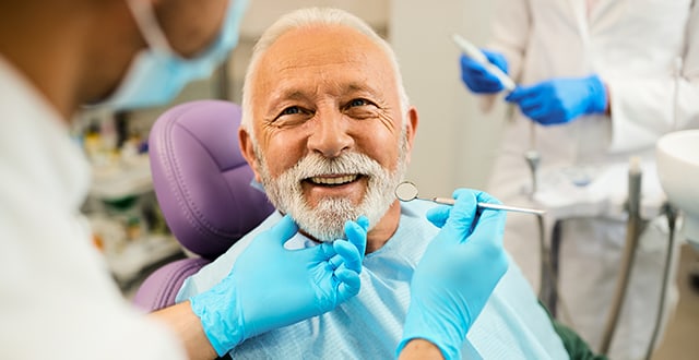 Man smiling at dentist