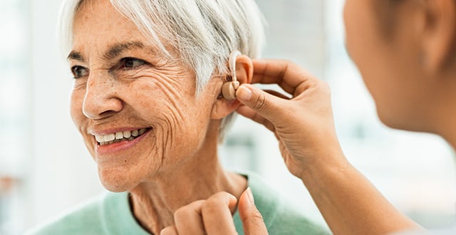 Woman receiving ear exam